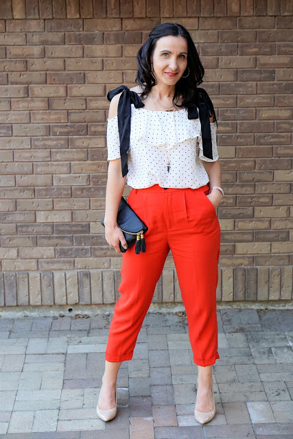 Red is such a powerful color and I love how Bo paired her red trousers ...