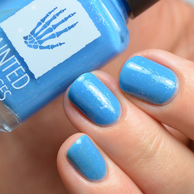 blue nail polish with flakies