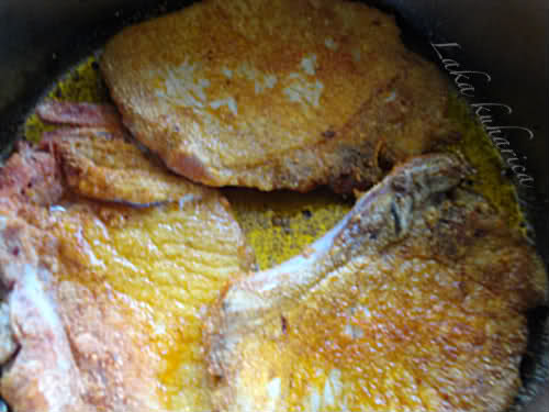 Pork cutlets with paprika and potatoes by Laka kuharica: Fry the cutlets for 3 minutes on each side