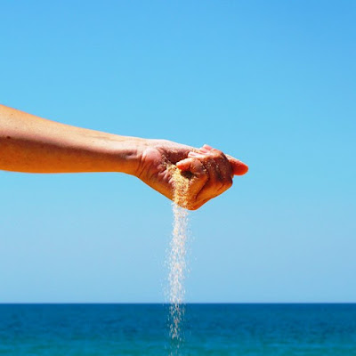 Sand slipping between the fingers