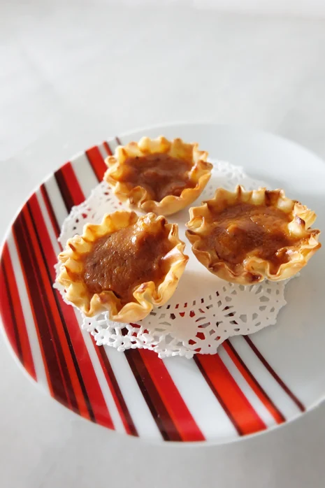 mini pumpkin pies in phyllo shells on a plate