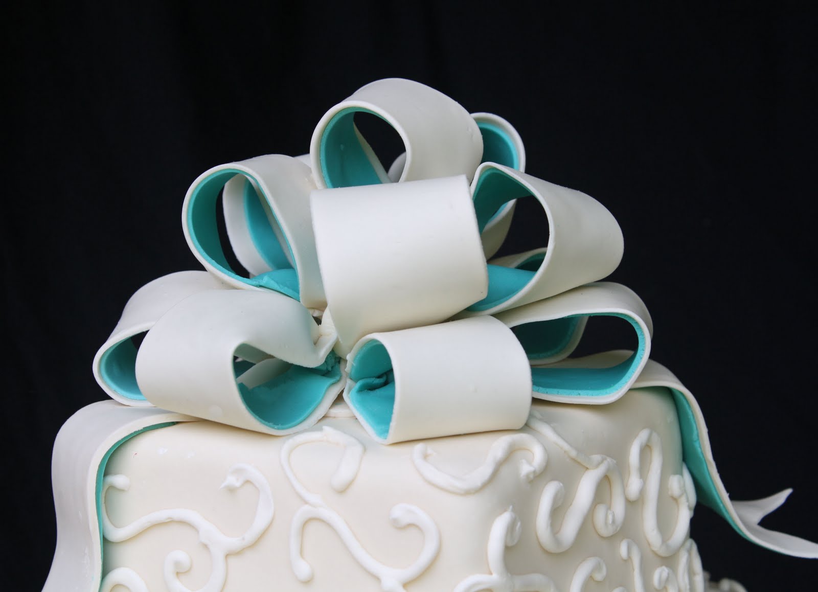 An Ivory And Teal Wedding Cake
