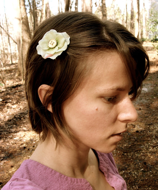 short hair style with green flower clip off to one side