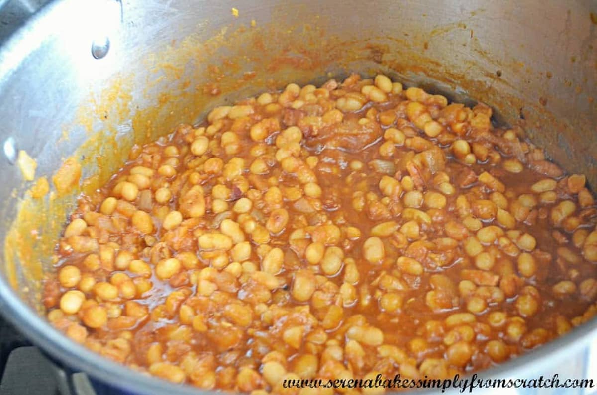 Baked Beans in a large stainless steel pot.