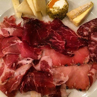 Taglio snack plate for aperitivo in Navigli Milan bar gourmet emporium and kitchen