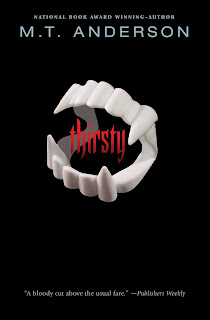 Plastic vampire teeth with the word "thirsty" in red floating between the top and bottom teeth