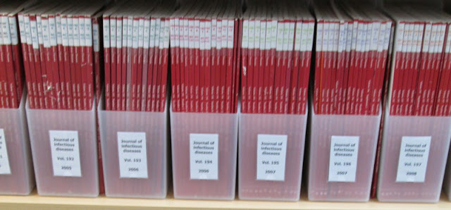 Boxes of journals on a shelf