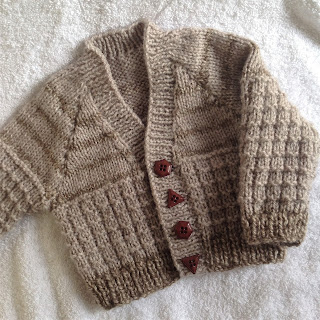 https://www.lovecrafts.com/en-gb/p/warm-waffled-baby-cardigan-knitting-pattern-by-seasonknits
