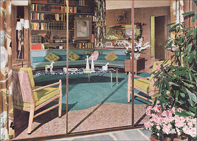 Mid-century living room with blue sofa and rug