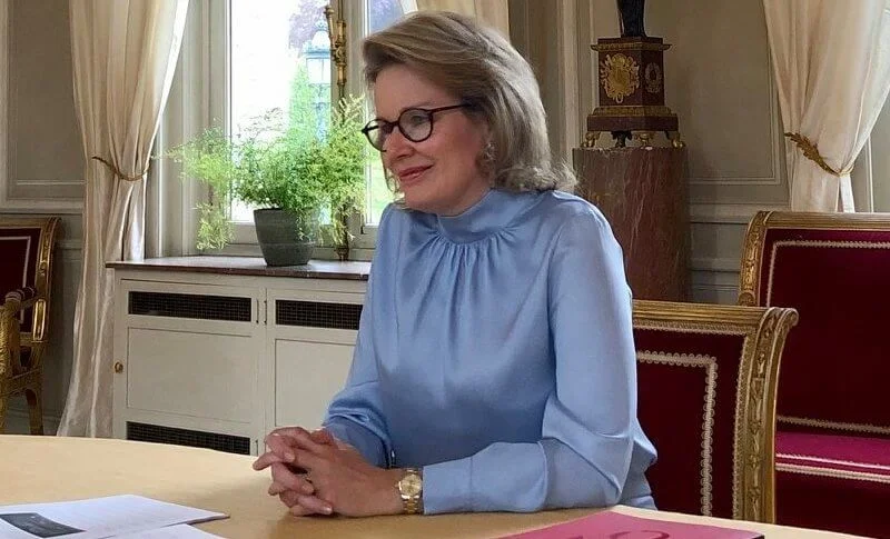 Queen Mathilde wore a sky blue tie-bow silk blouse from Natan Fall Winter 2020 collection, and sky blue trousers from Natan