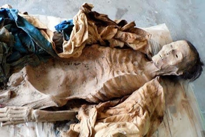 Archaeologists strip Xinjiang mummies to save ancient clothing