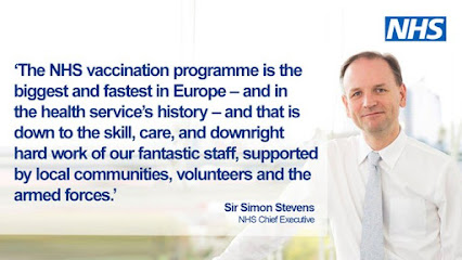 NHS Vaccination programme is the fastest in Europe test and smiley man in suit representing doctors