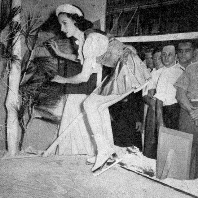 Skater Performing on a Tiny Ice Rink in Store Window, New York City
