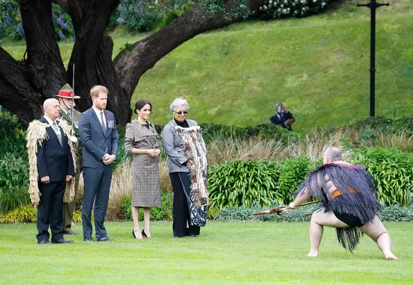 Meghan Markle wore Karen Walker Banks coat, Asos Design Maternity dress, Sarah Flint pumps and Birks Musecitrine and diamond drop earrings