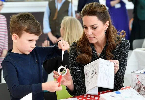 Kate Middleton wore a tweed suit by Dolce and Gabbana, Mappin and Webb Empress drop earrings, Gianvito Rossi Piper suede pumps