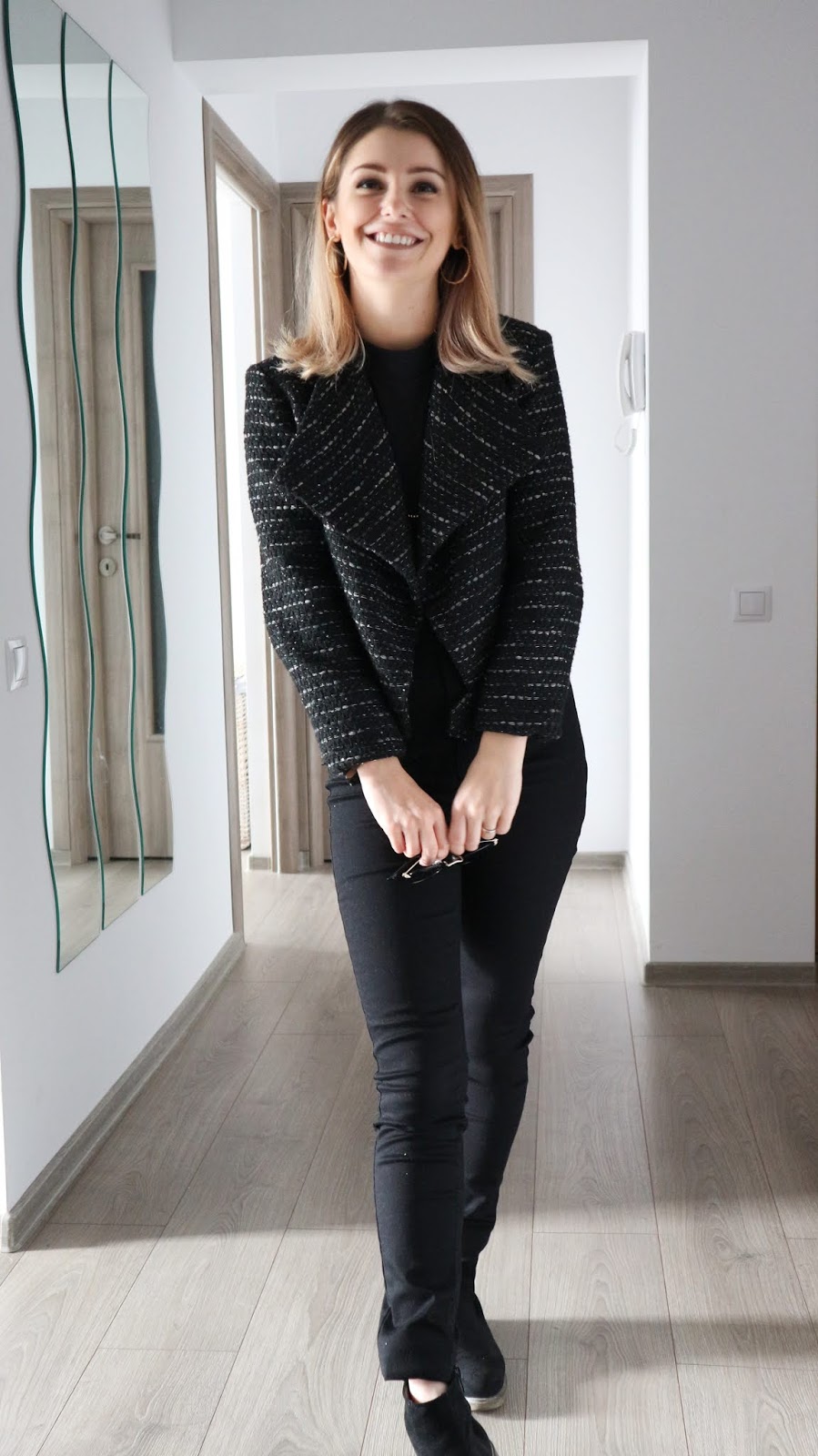 black style with tweed jacket and black jeans
