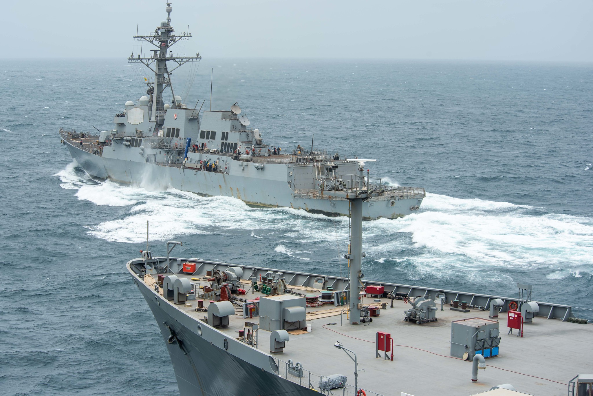 USS Halsey (DDG 97) steams ahead of USNS John Lenthall (TAO 189