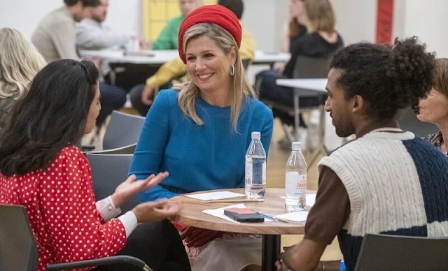 Queen Maxima wore a colourful midi skirt from Claes Iversen Haute Couture Spring Summer 2017 collection. Blue silk blouse