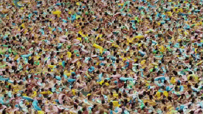 mass of humanity swimming pool waves