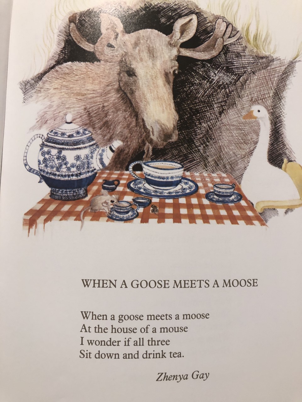 Momo celebrating time to read When a Goose meets a Moose Poems for