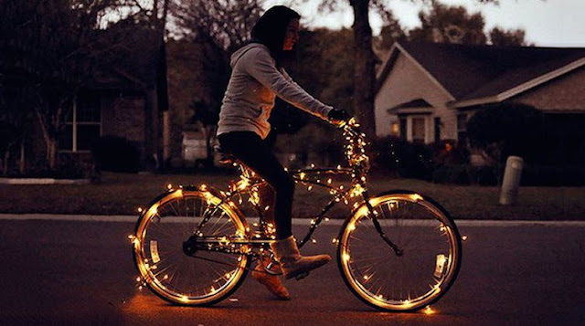 woman riding a bike with LED lights