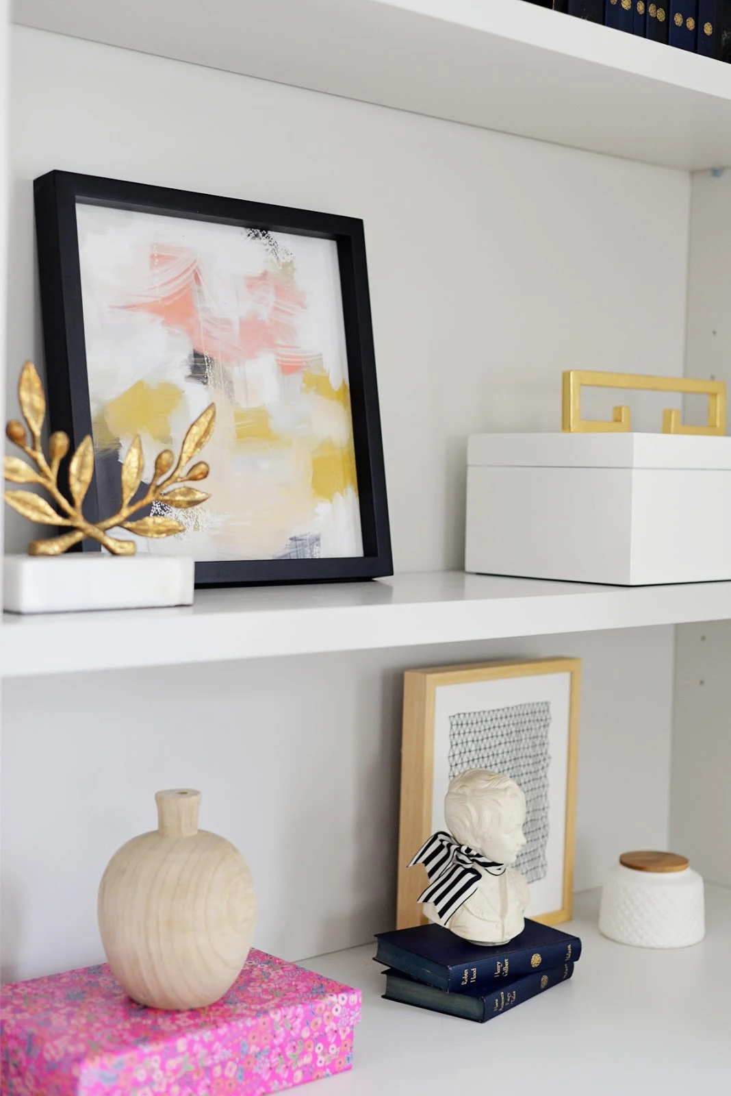 bookcase styling, pink and gold decor