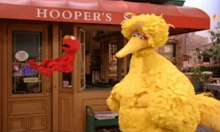 Snuffy sits down and Elmo slides off his back. Sesame Street Episode 4070, Snuffy's Invisible part 2, Season 35