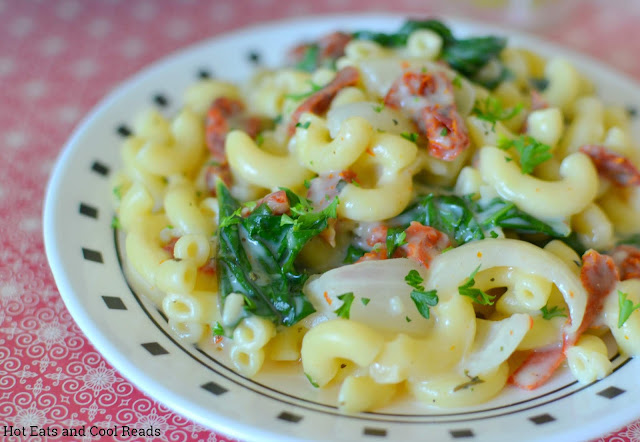 Creamy Garlic Parmesan Kale Macaroni Recipe from Hot Eats and Cool Reads! This 30 minute meal is delicious meatless, but also great with leftover rotisserie chicken or shrimp! We used fresh garden kale and onions for a quick summertime dinner, but it's great with store bought veggies for a winter meal too!