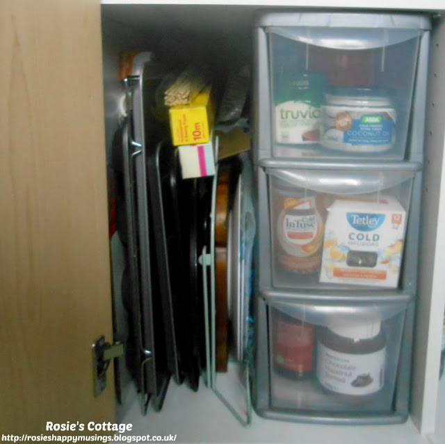 Kitchen Cabinet Re-Organisation: This shelf was possibly the easiest to organise because the it's home to items such as baking trays/cookie sheets and to a small set of plastic drawers, which I wanted to keep in place.