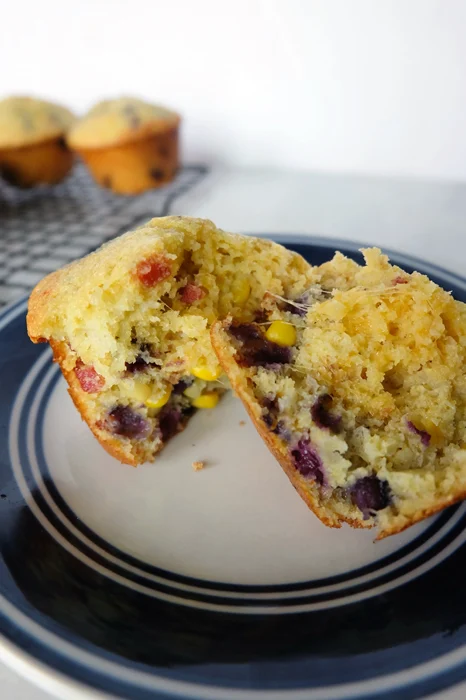 inside of cornbread muffin with blueberry bacon and cheddar cheese