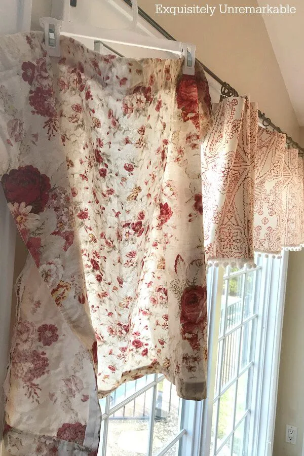 Hanging Upholstery Fabric To Dry in a window