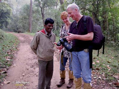 Showing some of the pictures to the guide