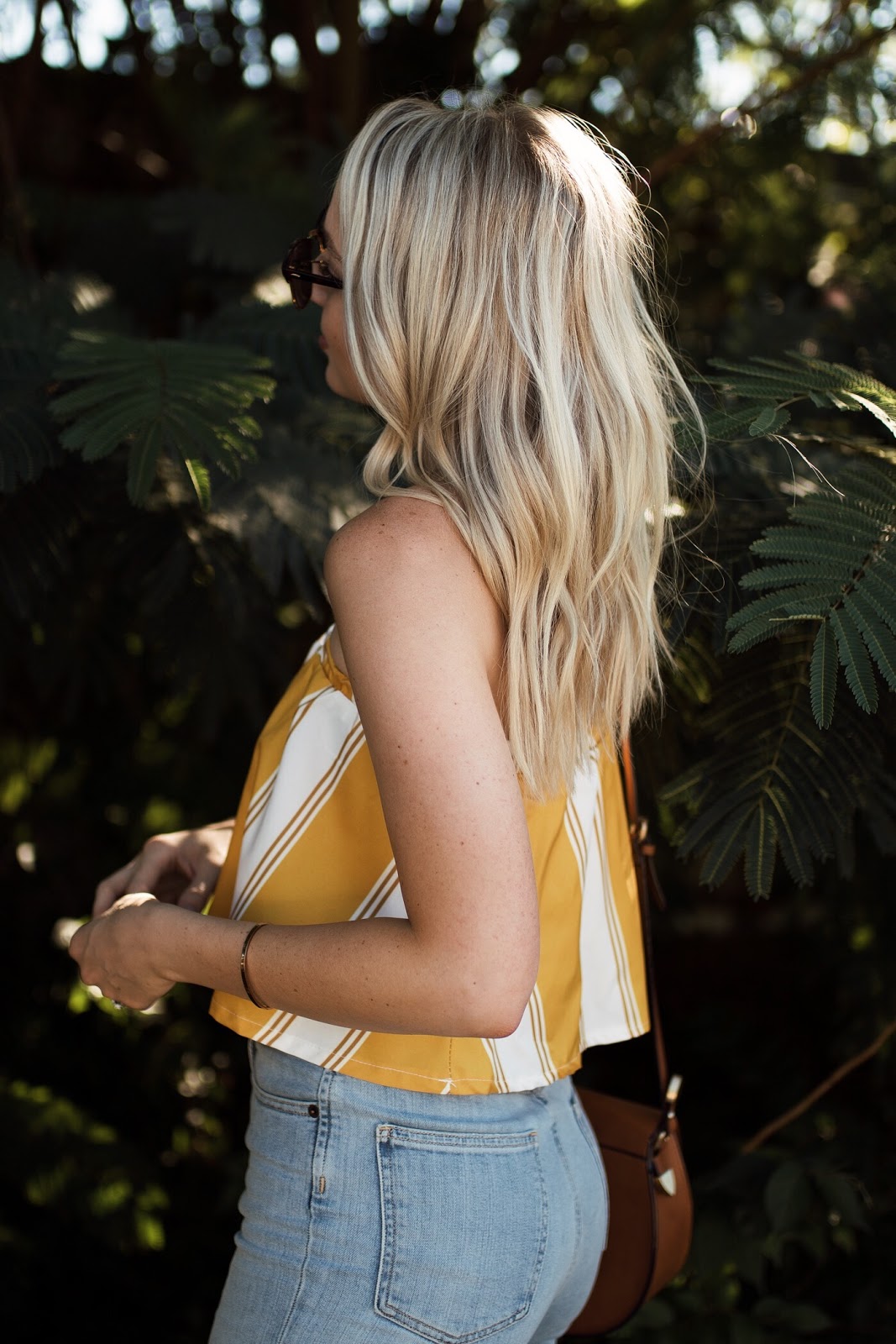 cool blonde, messy waves | yellow crop top