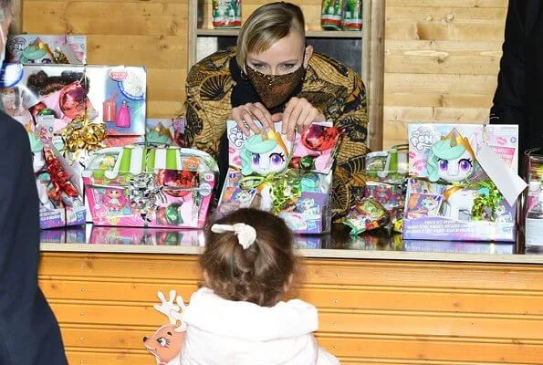 Prince Albert II, Princess Charlene, Hereditary Prince Jacques and Princess Gabriella. Princess Gabriella wore a new floral print raincoat from Jacadi