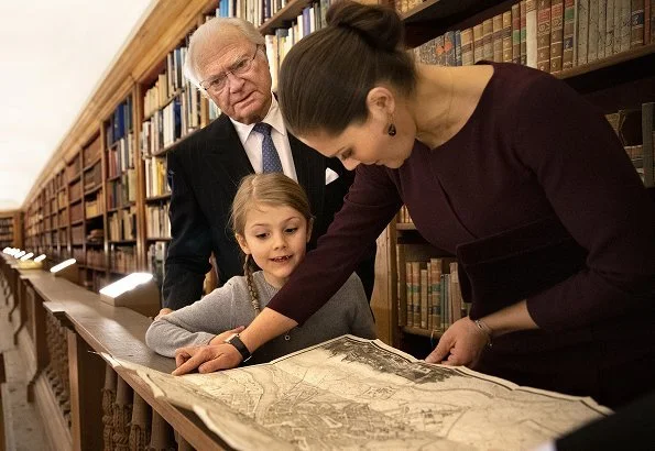 Princess Estelle visited the Bernadotte Library at the Royal Palace. Crown Princess Victoria wore Camilla Thulin Montana dress