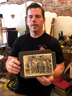 man holding historic photo