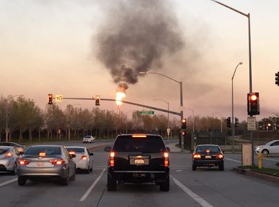 fire flare refinery at stop light