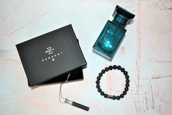 Vanacci trinity pendant and bracelet with perfume bottle in shot