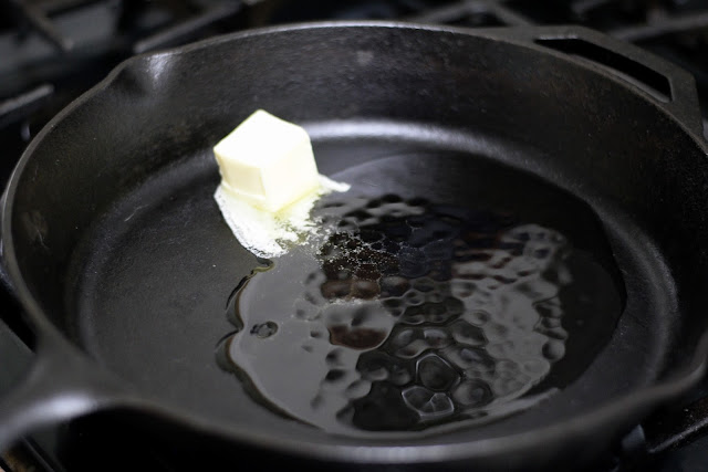 Butter and oil in a cast iron skillet on the stove. 