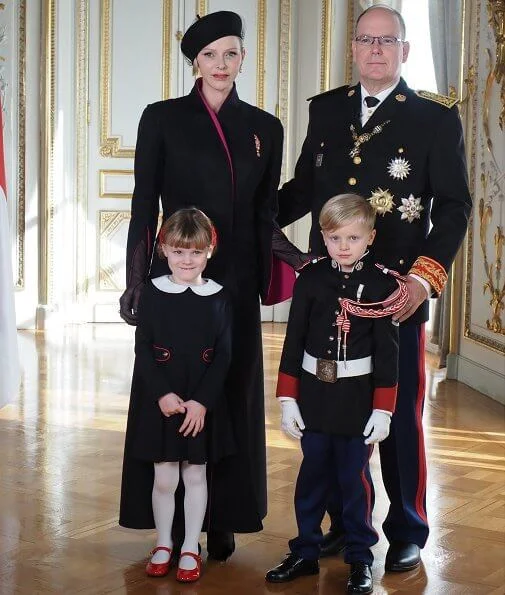 Princess Charlene wore a coat from Terrence Bray. Gabriella wore a dress from Jacadi