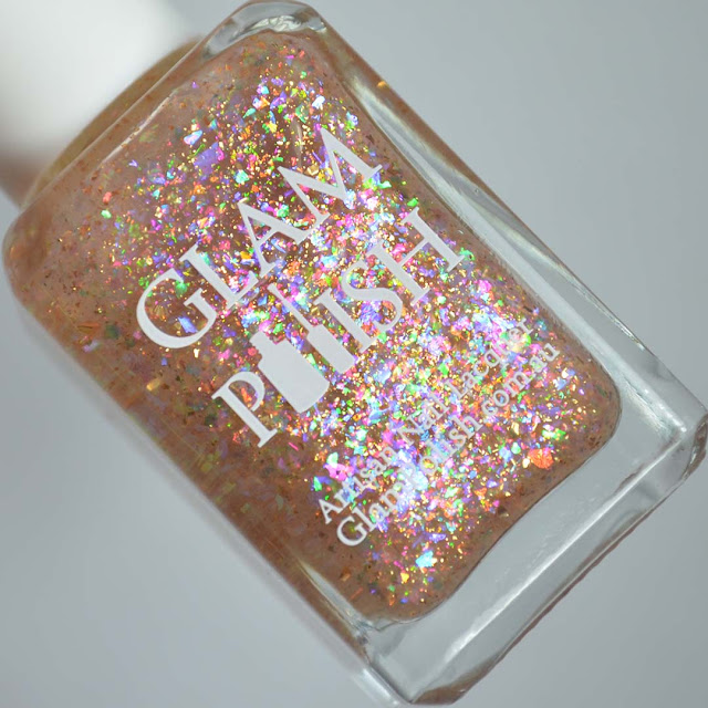 rainbow flakie nail polish in a bottle