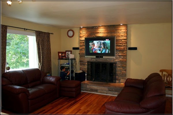 Living room with tv above fireplace
