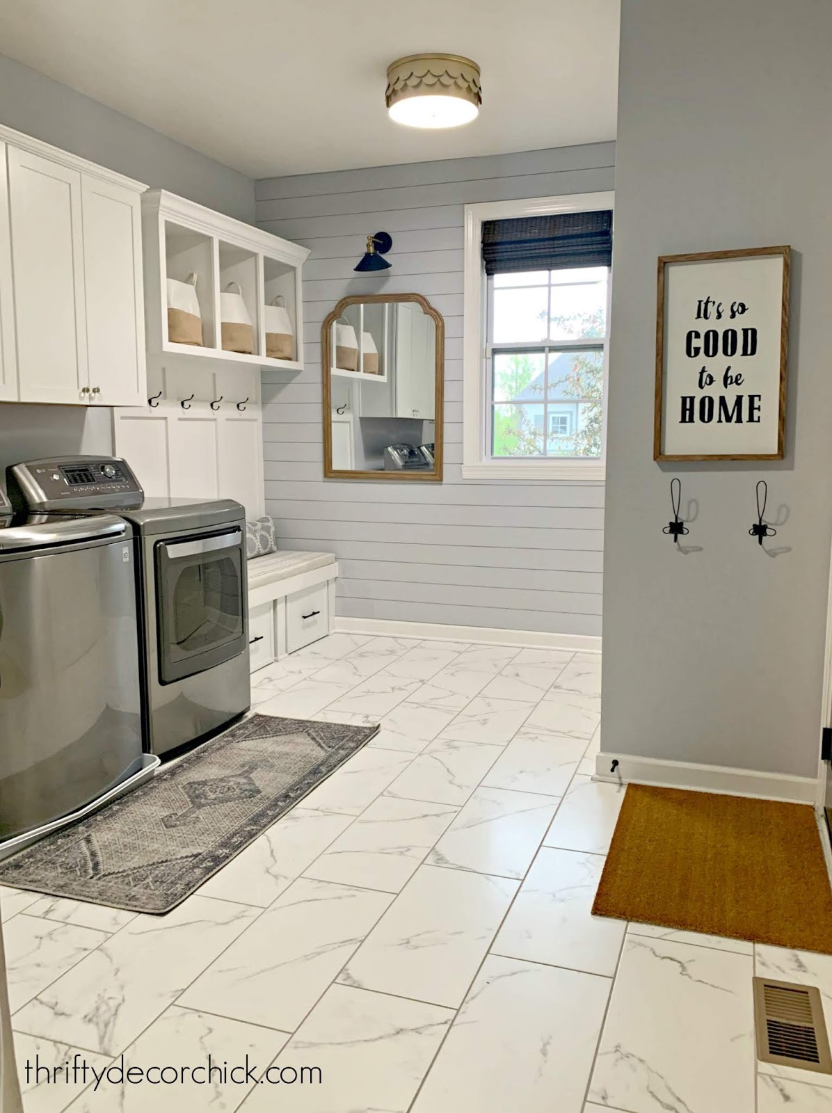 Gray and white laundry/mud room combo