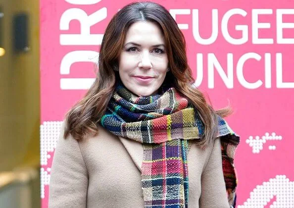 Crown Princess Mary wore a flared long coat from Max Mara, and black silk shirt. Handmade scarf crocheted-rainbow colors scarf