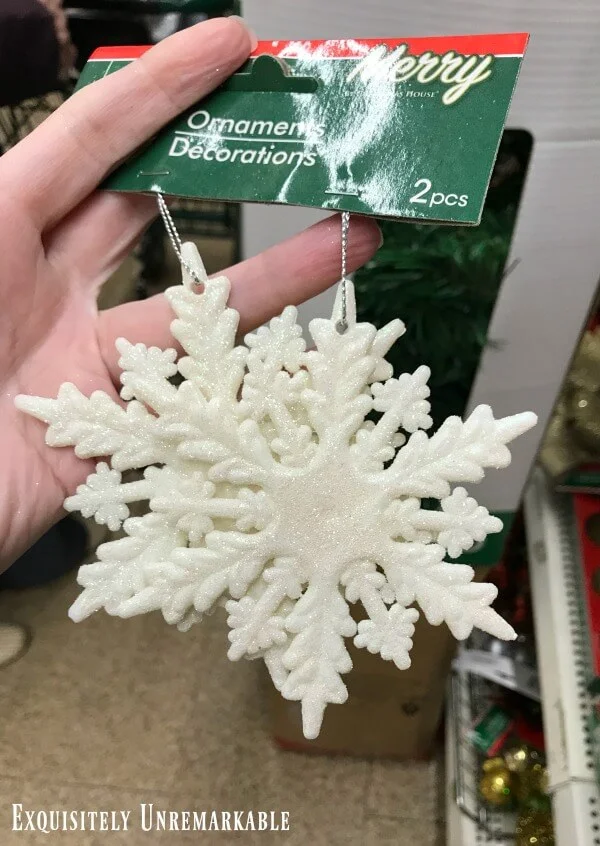 Two dangling large snowflake ornaments from Dollar Tree