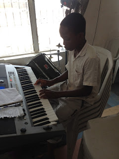 young nigerian child playing be magnified by don moen
