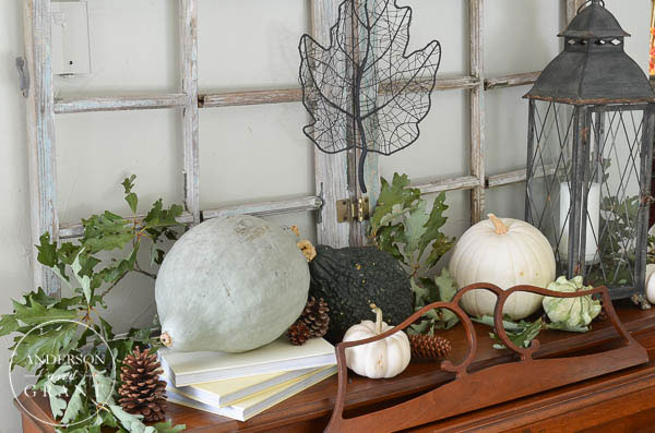 Create an interesting fall display using pumpkins, squash, and gourds in shades of green and white.  |  Farmhouse Fall Home Tour at www.andersonandgrant.com