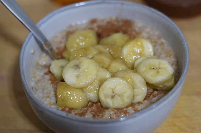 The maple glazed bananas being added tot he bowl of steel cut oats.