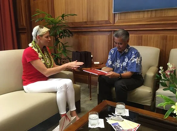 Princess Charlene of Monaco visited Honolulu, Hawaii met Governor David Idge. She wore red shirt and white pants