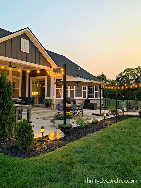 patio with outdoor light and round fire pit